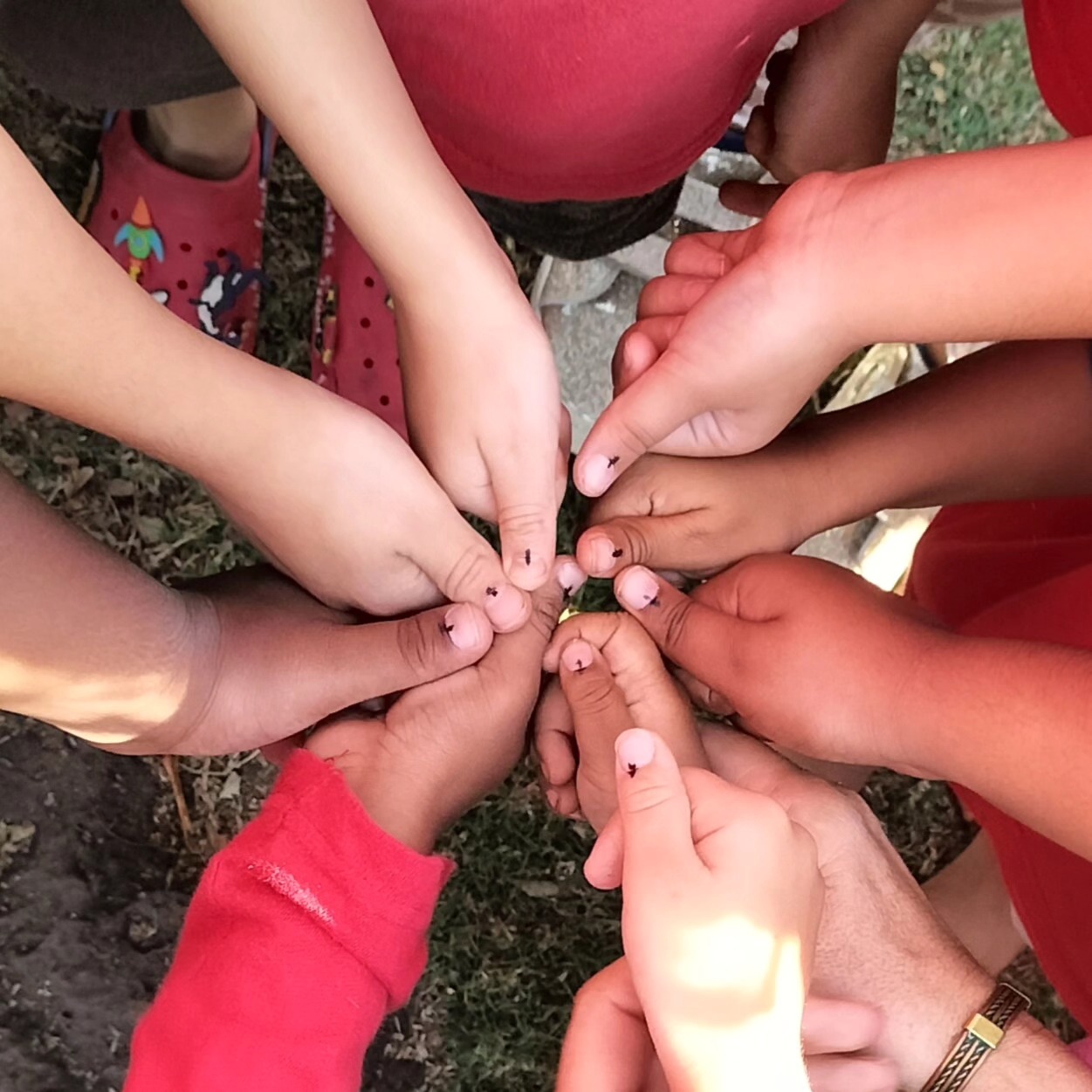 Children's hands engaged in a collaborative activity